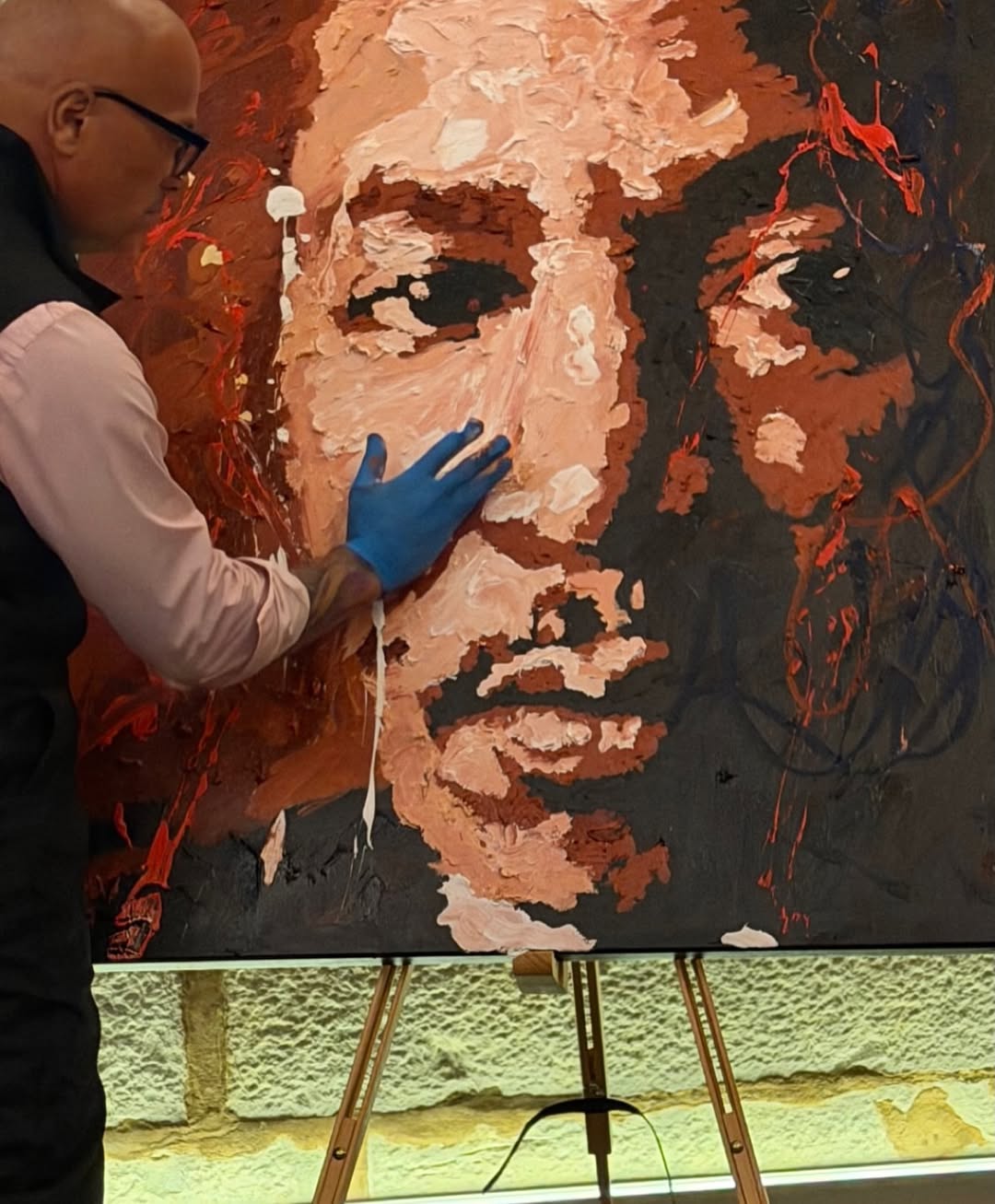 Ramaya Vallias painting "Presence that Echoes - MLK" during the Ceremony of Civil Diplomat Jethro International Org.