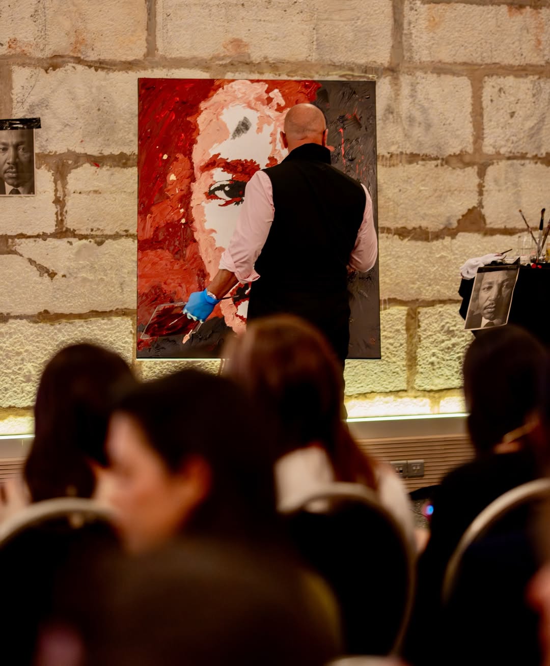 Ramaya Vallias painting "Presence that Echoes - MLK" during the Ceremony of Civil Diplomat Jethro International Org.